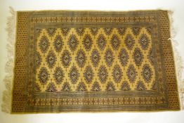 A gold ground Bokhara rug, 120 x 190cm