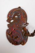 A Chinese carved horn dragon pendant, 9 x 5cm