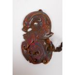 A Chinese carved horn dragon pendant, 9 x 5cm