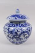 A blue and white porcelain ginger jar and cover with dragon and phoenix decoration, Chinese Xuande 6