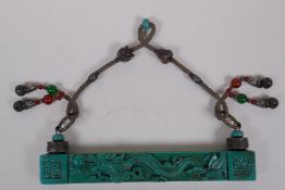 A Chinese turquoise glass scroll weight hanger decorated with a dragon chasing the flaming pearl,