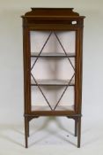 An Edwardian inlaid mahogany single door display cabinet, raised on tapering supports, 62 x 33 x