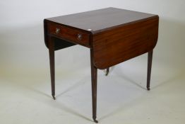 A Georgian mahogany pembroke table with single end drawer, raised on square tapering supports with