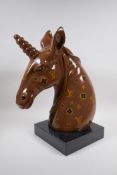 A composition bust of a unicorn with LV style decoration, 45cm high
