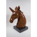 A composition bust of a unicorn with LV style decoration, 45cm high