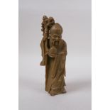 A Chinese carved soapstone figure of Shou Lao, 19cm high, mark to base