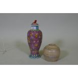 A Chinese ceramic jar and cover with enamel decoration, seal mark to base, 28cm high, and a