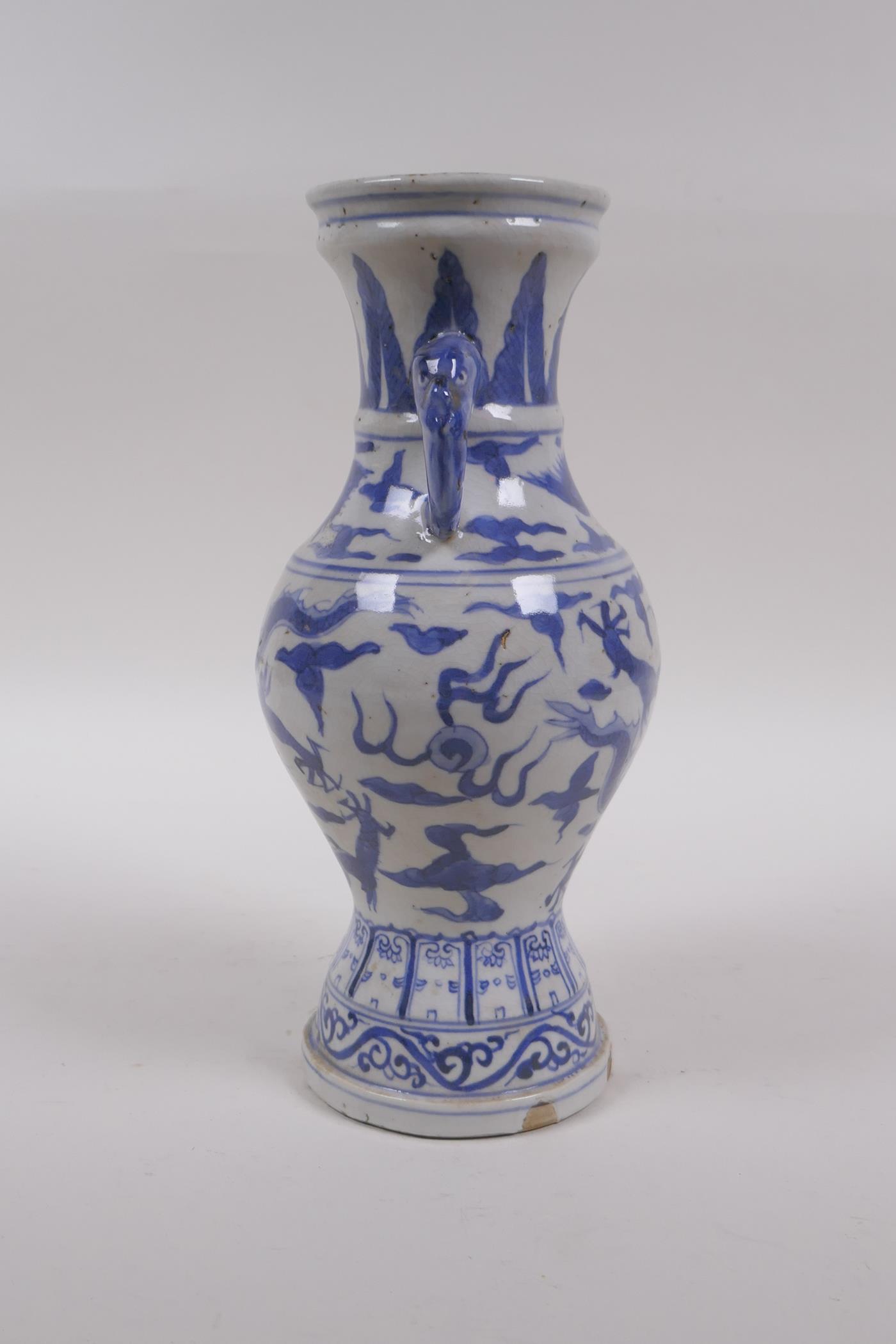 A Chinese blue and white porcelain vase with two elephant mask handles and dragon decoration, 23cm - Image 4 of 7