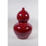 A large Chinese flambe glazed porcelain double gourd vase, 4 character mark to base, 44cm high