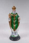 A painted plaster figure of a bearded priest, 46cm high, AF