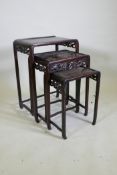 A nest of Chinese hardwood tables with carved dragon decoration, AF losses, largest 50 x 36, 72cm