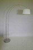 A contemporary brushed steel floor lamp, 180cm high