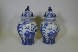 A pair of Chinese blue and white porcelain octagonal jar and covers, decorated with kylin in a