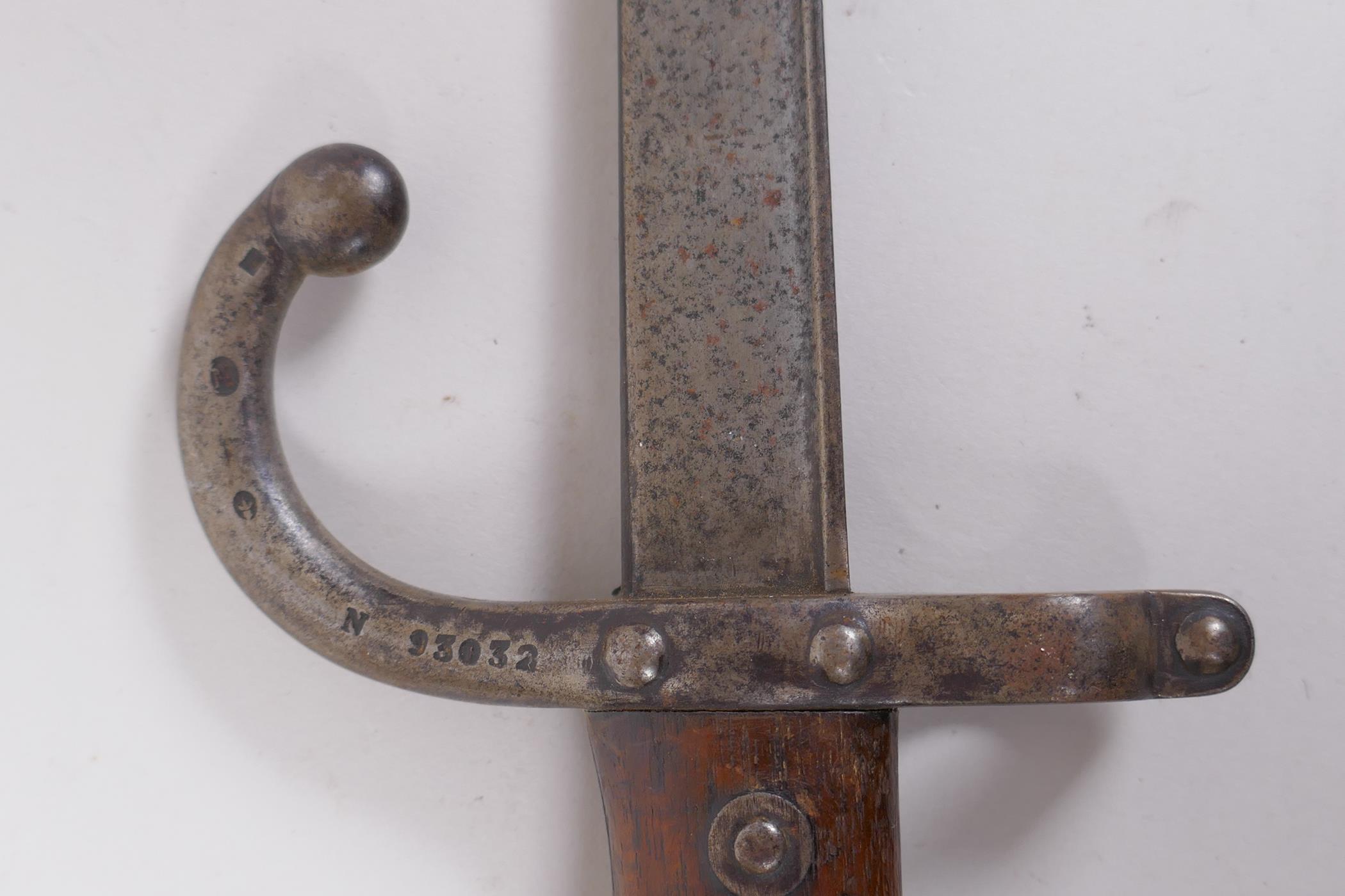 A late C19th French model 1880 short bayonet, manufactured in St Etienne, inscription to the - Image 7 of 8