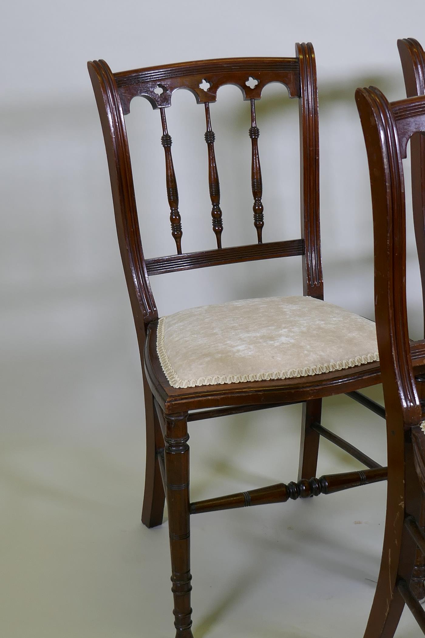 Four C19th beechwood and walnut side chairs with Gothic style backs, raised on turned tapering - Image 2 of 3