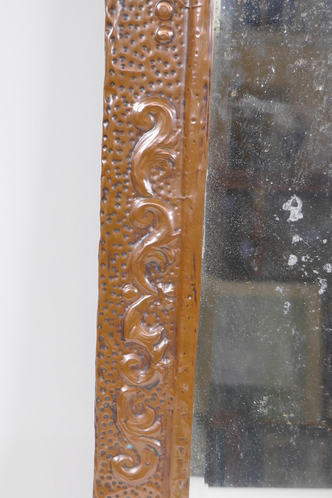 An antique beaten copper wall mirror with repousse swag decoration, 56 x 28cm - Image 3 of 3