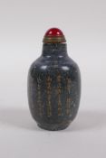 A Chinese mottled hardstone snuff bottle with chased and gilt character inscription, mark to base,