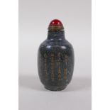 A Chinese mottled hardstone snuff bottle with chased and gilt character inscription, mark to base,