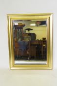 A contemporary gilt framed wall mirror with bevelled glass, 59 x 76cm