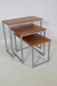 A contemporary nest of three tables, with veneered tops and metal supports, 57 x 29 x 54cm