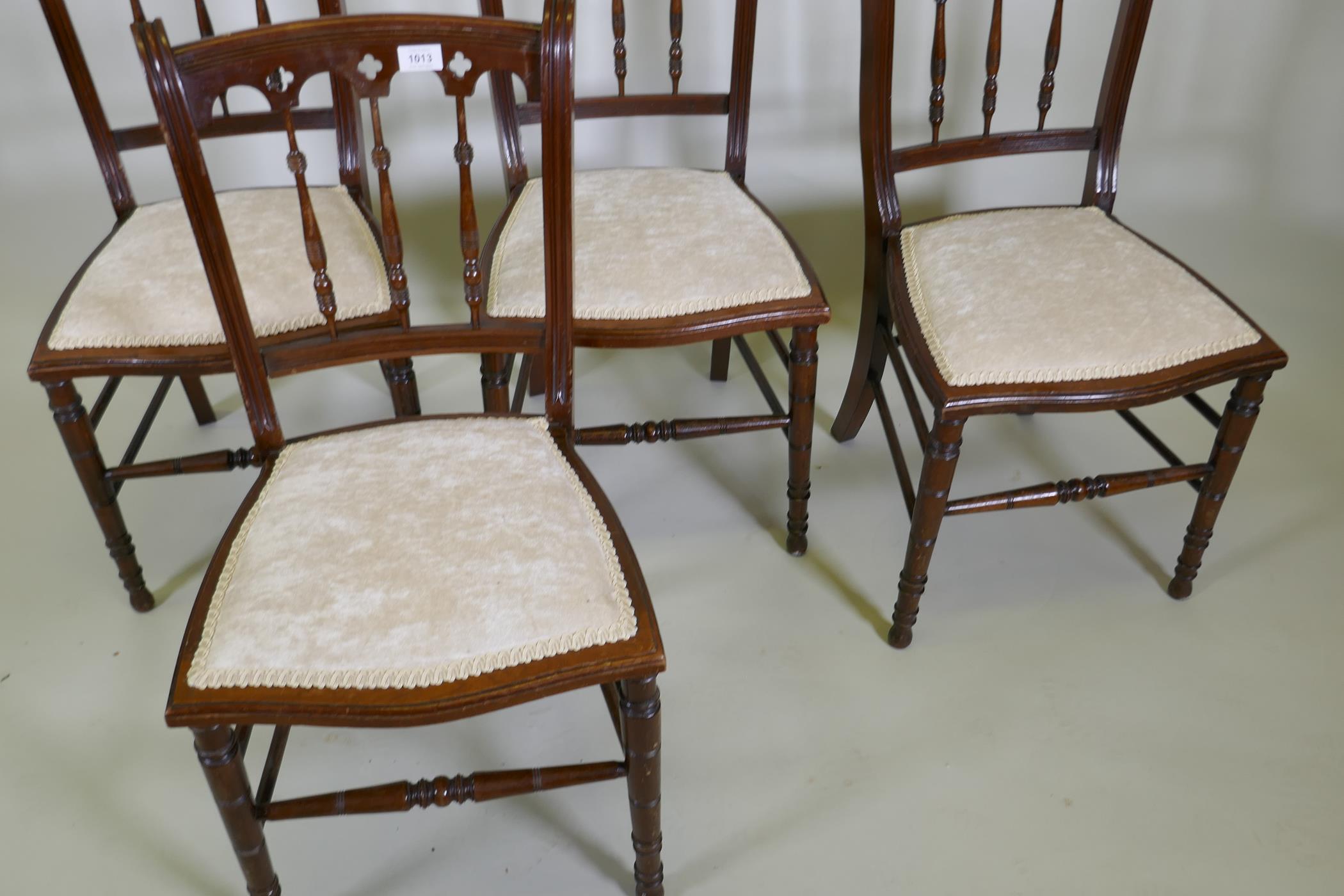 Four C19th beechwood and walnut side chairs with Gothic style backs, raised on turned tapering - Image 3 of 3