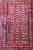 A fine woven red ground wool Bokharra rug, AF, 128 x 190cm