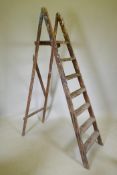 A vintage pine decorators's step ladder, 200cm long