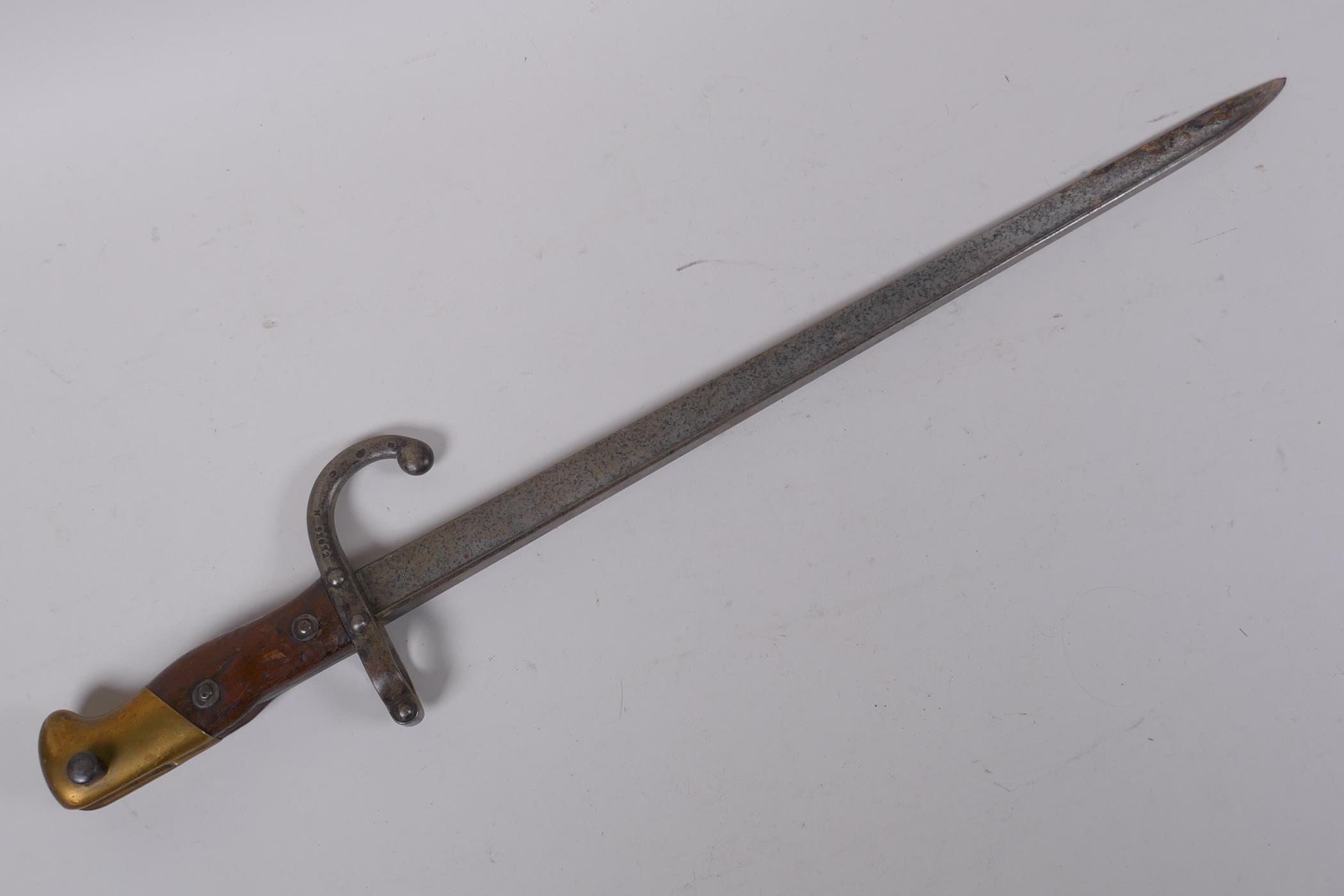 A late C19th French model 1880 short bayonet, manufactured in St Etienne, inscription to the - Image 8 of 8