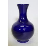 A Chinese deep blue glaze vase, six character mark to base, 34cm high