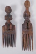 A pair of African Luba tribe combs with carved figural handles, largest 27cm