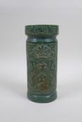 A Chinese reconstituted green hardstone brush pot decorated with dragons and character inscriptions,