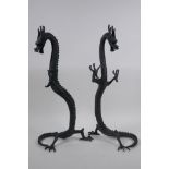 A pair of Chinese bronzed metal dragons, 40 cm high