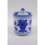 A Chinese blue and white porcelain cylinder pot and cover decorated with objects of virtue, 16cm