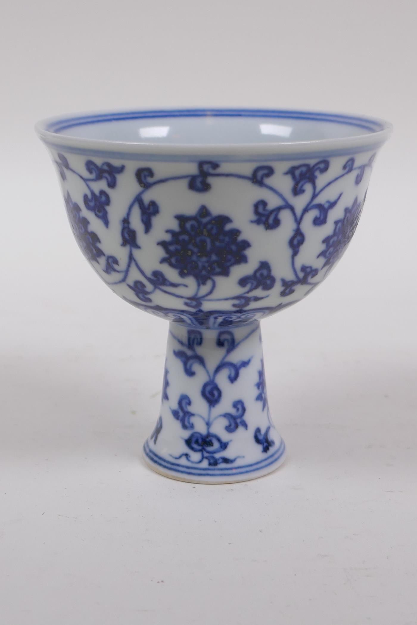 A blue and white porcelain stem bowl with scrolling lotus flower decoration, Chinese Xuande 6 - Image 3 of 5