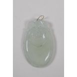 A Chinese translucent hardstone pendant with carved ruyi decoration and a yellow metal loop, 3 x 5cm