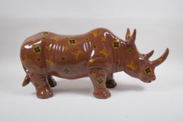 A painted composition rhino with LV style decoration, 52cm long