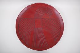 A Chinese red Tixi lacquer charger with stylised bird decoration, Xuande 4 character mark to base,