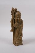 A Chinese carved soapstone figure of Shou Lao, 19cm high, mark to base