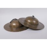 A pair of Tibetan brass ceremonial 'Rol Mo' cymbals, 24cm diameter