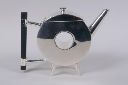 A Christopher Dresser style silver plated teapot with ebonised wood handles, 15cm high