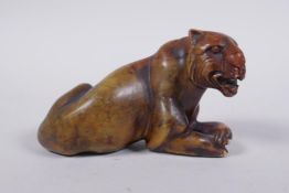 An oriental soapstone carving of a tiger, 11cm long