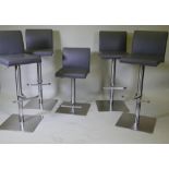 A set of five brushed steel swivel and height adjustable kitchen bar stools, 105cm extended