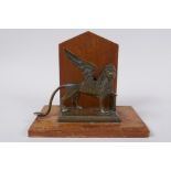 A mahogany letter rack mounted with a bronze griffin, 14cm high