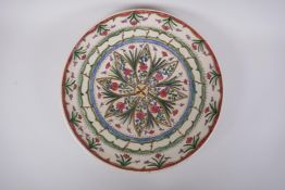 A hand painted studio pottery charger, signed 'Doyer' to base and dated '95, 36cm diameter