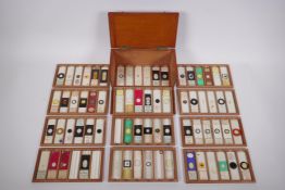 A fine collection of antique scientific microscope slides, many with annotations and labels, all