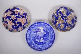 A pair of C19th transfer decorated plates in the Imari palette and a blue and white cake plate