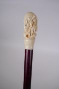 A walking cane with bone handle carved in the form of a rat, 91cm long