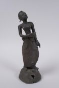 An antique Burmese bronze female figure, 21cm high