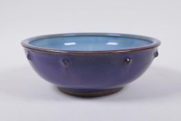 A Chinese Jun ware bowl, indistinct  inscribed character mark to base, 18 cm diameter