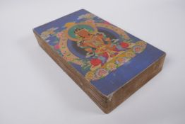 A Sino Tibetan printed concertina book containing thangka depictions, 17 x 29cm